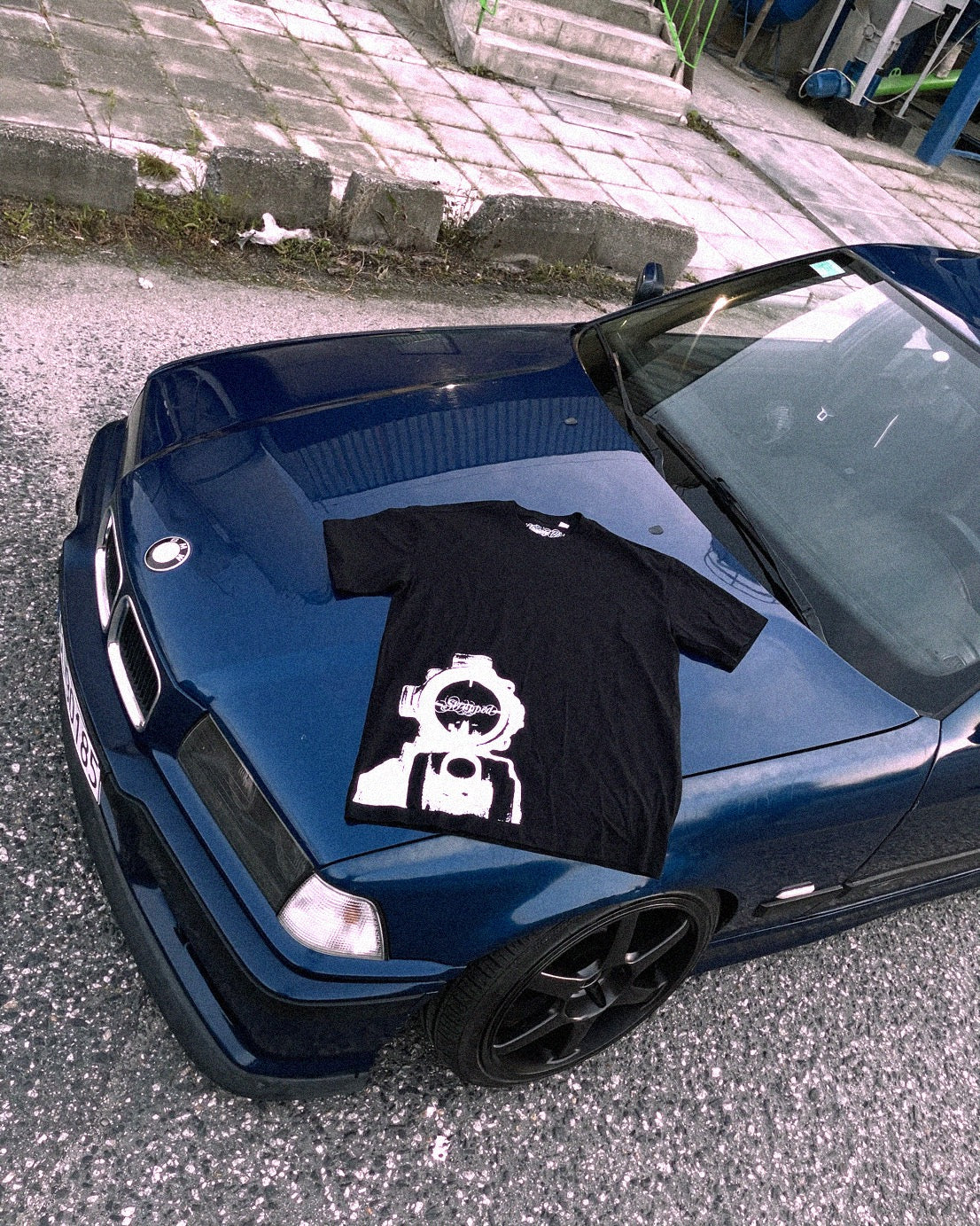 Strapped AIM tee